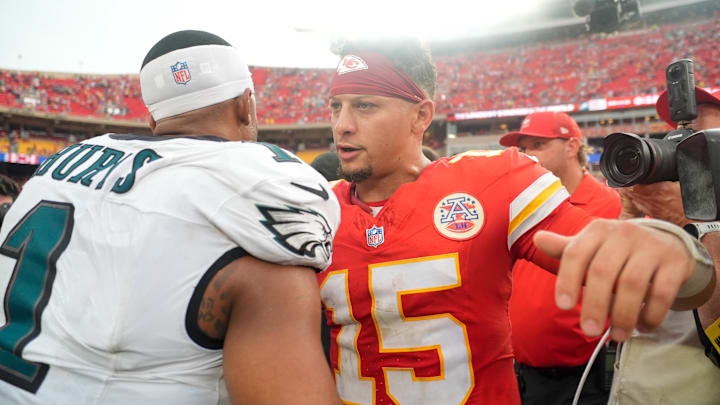 Sep 14, 2025; Kansas City, Missouri, USA; Philadelphia Eagles quarterback Jalen Hurts (1) and Kansas City Chiefs quarterback Patrick Mahomes (15) greet eachother after the game at GEHA Field at Arrowhead Stadium. Mandatory Credit: Jay Biggerstaff-Imagn Images