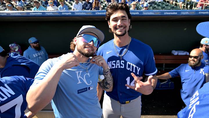 Feb 20, 2026; Surprise, Arizona, USA; Kansas City Royals catcher Carter Jensen (22) and right fielder Jac Caglianone (14) in the dugout prior to the game against the Texas Rangers at Surprise Stadium. Mandatory Credit: Jayne Kamin-Oncea-Imagn Images Feb 20, 2026; Surprise, Arizona, USA; Kansas City Royals catcher Carter Jensen (22) and right fielder Jac Caglianone (14) in the dugout prior to the game against the Texas Rangers at Surprise Stadium. Mandatory Credit: Jayne Kamin-Oncea-Imagn Images