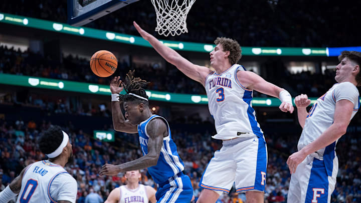 Kentucky guard Denzel Aberdeen (1) is fouled on a shot against Florida during their quarterfinal game of the 2026 SEC Men’s Basketball Tournament at Bridgestone Arena in Nashville, Tenn., Friday, March 13, 2026. Kentucky guard Denzel Aberdeen (1) is fouled on a shot against Florida during their quarterfinal game of the 2026 SEC Men’s Basketball Tournament at Bridgestone Arena in Nashville, Tenn., Friday, March 13, 2026.