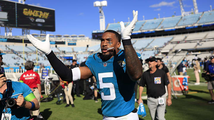 Jacksonville Jaguars safety Andre Cisco (5) claps for fans after an NFL football matchup Sunday,