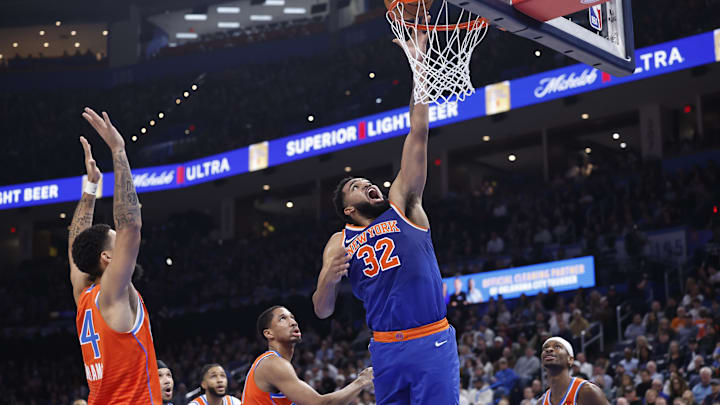 Jan 3, 2025; Oklahoma City, Oklahoma, USA;New York Knicks center Karl-Anthony Towns (32) shoots against the Oklahoma City Thunder during the second quarter at Paycom Center. Mandatory Credit: Alonzo Adams-Imagn Images