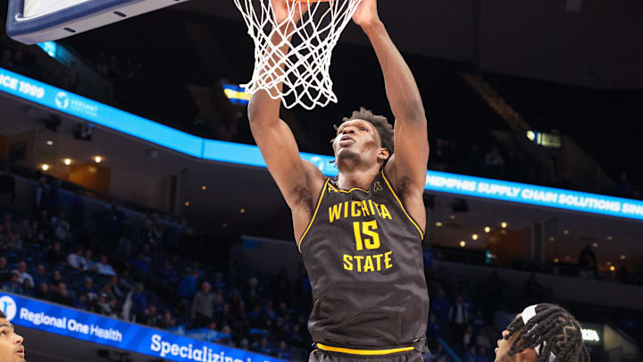 Jan 23, 2025; Memphis, Tennessee, USA; Wichita State Shockers center Quincy Ballard (15) dunks the ball against the Memphis Tigers during the second half at FedExForum. Mandatory Credit: Wesley Hale-Imagn Images