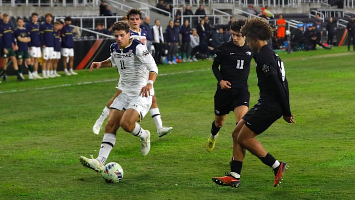 Notre Dame   s Daniel Russo drives the ball against Oregon State   s Enzo Newman in the College Cup.
Dec. 8, 2023