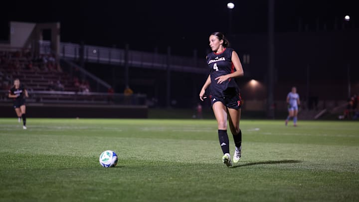 Nebraska defender Karli Williams plays the ball in space against Michigan.