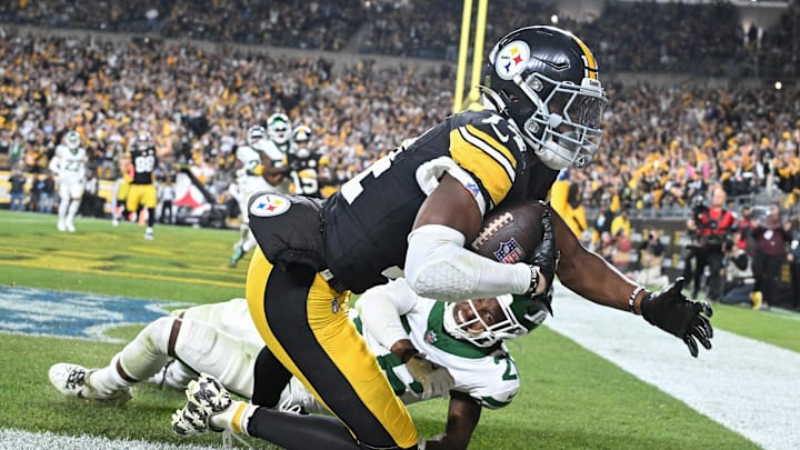 Oct 20, 2024; Pittsburgh, Pennsylvania, USA; Pittsburgh Steelers wide receiver George Pickens (14) catches an 11 yard touchdown pass in front of New York Jets cornerback Brandin Echols (26) during the second quarter at Acrisure Stadium. Mandatory Credit: Barry Reeger-Imagn Images