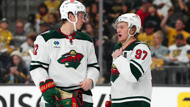 Apr 22, 2025; Las Vegas, Nevada, USA; Minnesota Wild left wing Matt Boldy (12) talks to Minnesota Wild left wing Kirill Kaprizov (97) before a face off against the Vegas Golden Knights during the second period of game two of the first round of the 2025 Stanley Cup Playoffs at T-Mobile Arena. Mandatory Credit: Stephen R. Sylvanie-Imagn Images