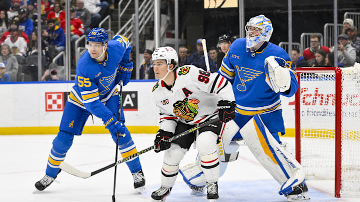 Dec 12, 2025; St. Louis, Missouri, USA; St. Louis Blues goaltender Joel Hofer (30) and defenseman Colton Parayko (55) defend the net against Chicago Blackhawks center Connor Bedard (98) during the third period at Enterprise Center. Mandatory Credit: Jeff Curry-Imagn Images Dec 12, 2025; St. Louis, Missouri, USA; St. Louis Blues goaltender Joel Hofer (30) and defenseman Colton Parayko (55) defend the net against Chicago Blackhawks center Connor Bedard (98) during the third period at Enterprise Center. Mandatory Credit: Jeff Curry-Imagn Images