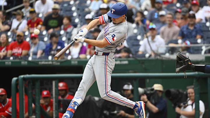 Jun 8, 2025; Washington, District of Columbia, USA; Texas Rangers center fielder Evan Carter (32) hits a two run home run against the Washington Nationals during the second inning at Nationals Park. 