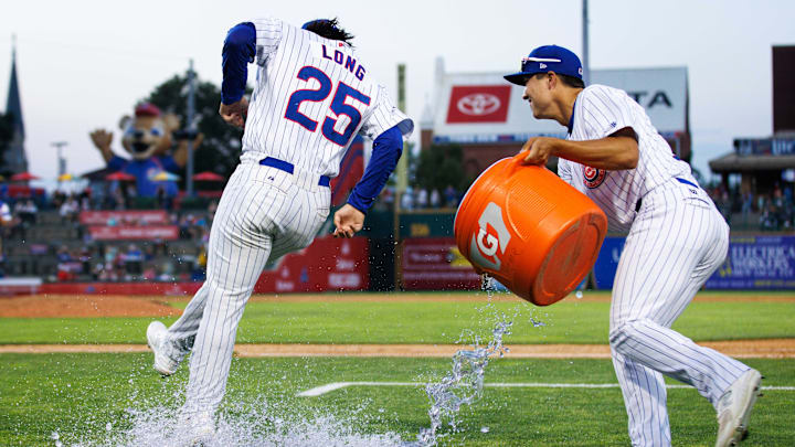 South Bend Cubs outfielder Brett Bateman, right, throws water on infielder Jonathon Long after winning a minor league baseball game 4-3 against the Lake County Captains at Four Winds Field on Friday, June 21, 2024, in South Bend.
