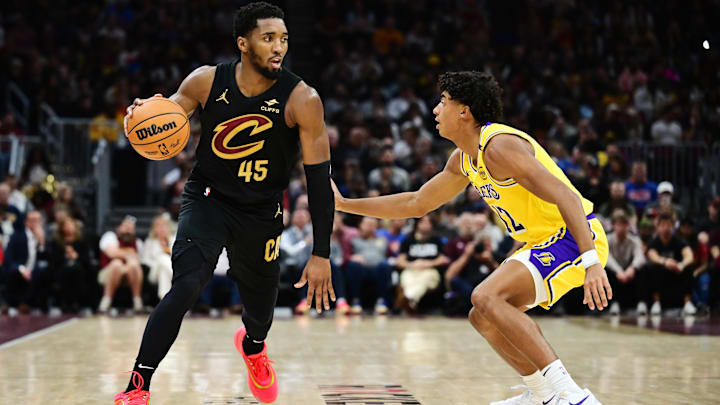 Oct 30, 2024; Cleveland, Ohio, USA; Los Angeles Lakers guard Max Christie (12) defends Cleveland Cavaliers guard Donovan Mitchell (45) during the first half at Rocket Mortgage FieldHouse. Mandatory Credit: Ken Blaze-Imagn Images Oct 30, 2024; Cleveland, Ohio, USA; Los Angeles Lakers guard Max Christie (12) defends Cleveland Cavaliers guard Donovan Mitchell (45) during the first half at Rocket Mortgage FieldHouse. Mandatory Credit: Ken Blaze-Imagn Images