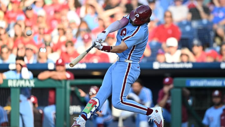Jun 27, 2024; Philadelphia, Pennsylvania, USA; Philadelphia Phillies first baseman Bryce Harper (3) hits an RBI double against the Miami Marlins in the first inning at Citizens Bank Park. 