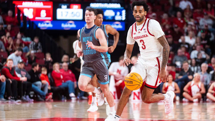 Dec 1, 2024; Lincoln, Nebraska, USA; Nebraska Cornhuskers guard Brice Williams (3) drives against North Florida Ospreys guard Oscar Berry (33) during the first half at Pinnacle Bank Arena.