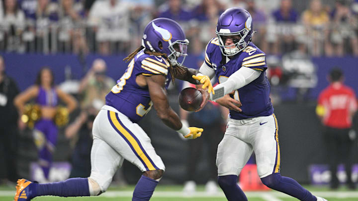 Sep 14, 2025; Minneapolis, Minnesota, USA; Minnesota Vikings quarterback J.J. McCarthy (9) hands off the ball to Minnesota Vikings running back Aaron Jones Sr. (33) during the first half at U.S. Bank Stadium.