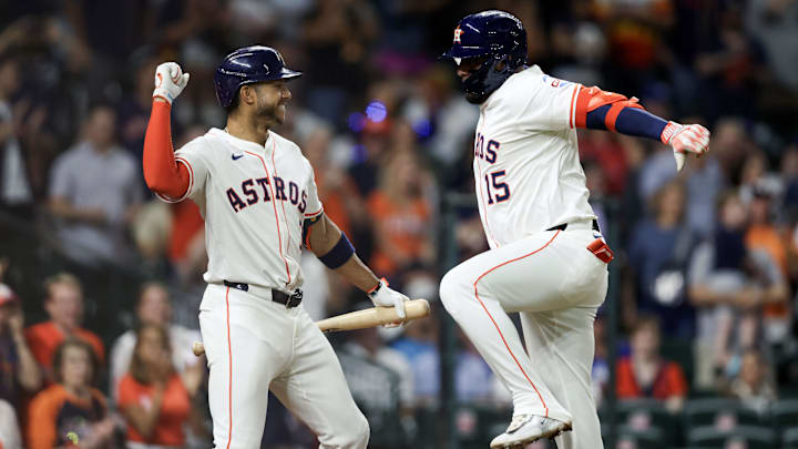 Apr 22, 2025; Houston, Texas, USA; Houston Astros third baseman Isaac Paredes (15) celebrates with shortstop Jeremy Pena (3) after hitting a home run during the seventh inning against the Toronto Blue Jays at Daikin Park. 