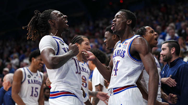 Jan 13, 2026; Lawrence, Kansas, USA; Kansas Jayhawks guard Jamari McDowell (11) and guard Melvin Council Jr. (14) celebrate during the second half against the Iowa State Cyclones at Allen Fieldhouse. Mandatory Credit: Jay Biggerstaff-Imagn Images