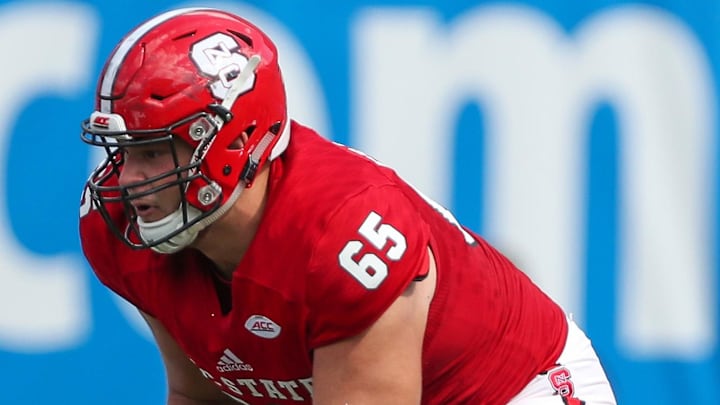 Sep 2, 2017; Charlotte, NC, USA; North Carolina State Wolfpack guard Garrett Bradbury (65) against the South Carolina Gamecocks during the college football opener at Bank of America Stadium. Mandatory Credit: Jim Dedmon-Imagn Images
