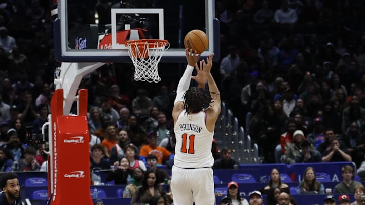 Dec 28, 2024; Washington, District of Columbia, USA; New York Knicks guard Jalen Brunson (11) shoots the ball against the Washington Wizards in overtime at Capital One Arena. Mandatory Credit: Geoff Burke-Imagn Images