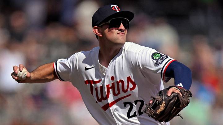 Minnesota Twins infielder Brooks Lee (22) throws to first for a force out.  Credit: Nick Wosika-Imagn Images