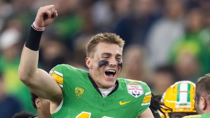 Jan 1, 2024; Glendale, AZ, USA; Oregon Ducks quarterback Bo Nix (10) celebrates after defeating the