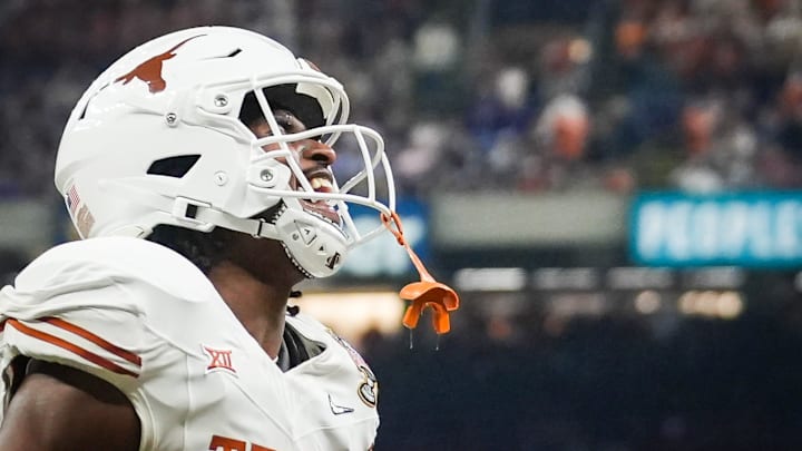 Texas Longhorns running back CJ Baxter (4) celebrates a play.