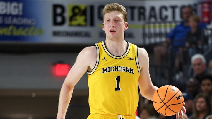 Nov 27, 2024; Fort Myers, Florida, USA; Michigan Wolverines center Danny Wolf (1) controls the ball against the Xavier Musketeers in the second half at Suncoast Credit Union Arena. Mandatory Credit: Nathan Ray Seebeck-Imagn Images