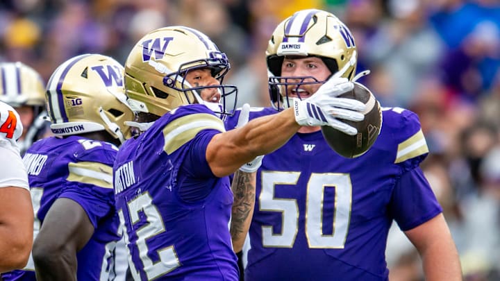 Denzel Boston signals first down while Carver Willis shares in the moment. Denzel Boston signals first down while Carver Willis shares in the moment.