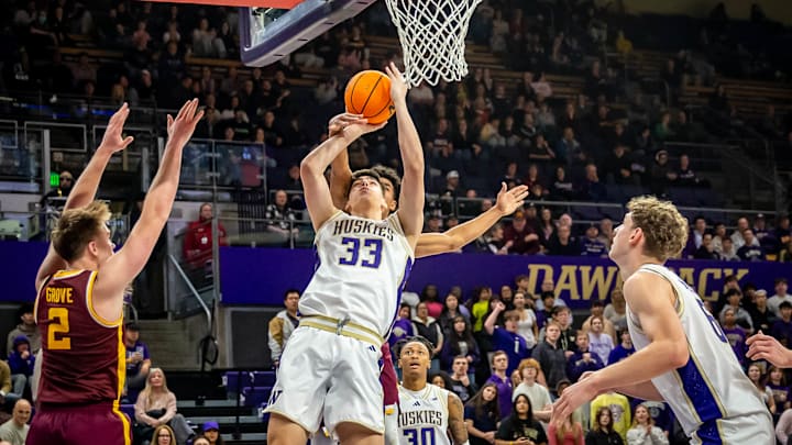 Niko Dzepina gets grabbed from behind against Minnesota. 