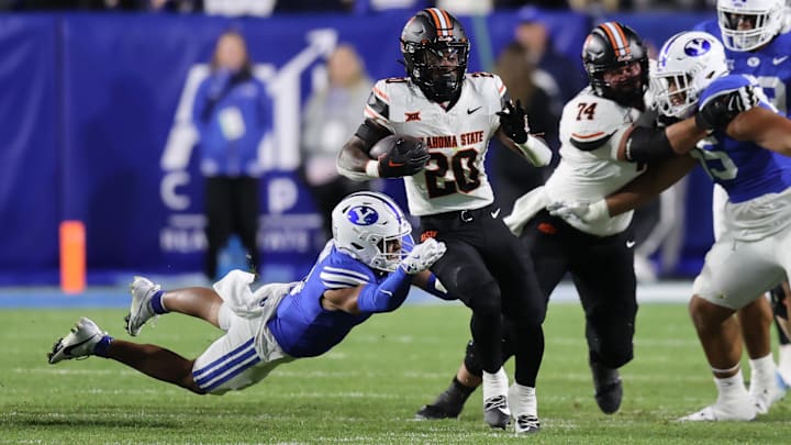 Oct 18, 2024; Provo, Utah, USA; Oklahoma State Cowboys running back Rodney Fields Jr. (20) runs the ball against the Brigham Young Cougars during the third quarter at LaVell Edwards Stadium. Mandatory Credit: Rob Gray-Imagn Images Oct 18, 2024; Provo, Utah, USA; Oklahoma State Cowboys running back Rodney Fields Jr. (20) runs the ball against the Brigham Young Cougars during the third quarter at LaVell Edwards Stadium. Mandatory Credit: Rob Gray-Imagn Images