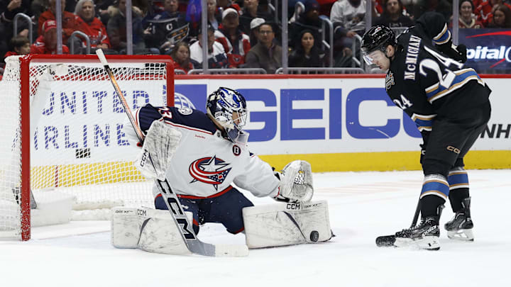 Apr 13, 2025; Washington, District of Columbia, USA; Columbus Blue Jackets goaltender Jet Greaves (73) makes a save on Washington Capitals center Connor McMichael (24) in the first period at Capital One Arena. Mandatory Credit: Geoff Burke-Imagn Images Apr 13, 2025; Washington, District of Columbia, USA; Columbus Blue Jackets goaltender Jet Greaves (73) makes a save on Washington Capitals center Connor McMichael (24) in the first period at Capital One Arena. Mandatory Credit: Geoff Burke-Imagn Images