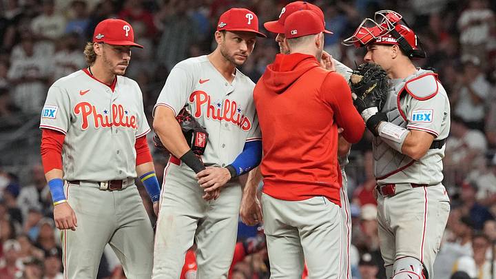 Oct 1, 2026; Cumberland, Georgia, USA; Philadelphia Phillies infielder Trea Turner (7) listens to pitching coach Caleb Cotham (65) with infielders Bryson Stott (5) and Edmundo Sosa (33) during a mound visit against the Atlanta Braves in the sixth inning in game three of the Wildcard round for the 2026 MLB Playoffs at Truist Field. Mandatory Credit: Dale Zanine-Imagn Images Oct 1, 2026; Cumberland, Georgia, USA; Philadelphia Phillies infielder Trea Turner (7) listens to pitching coach Caleb Cotham (65) with infielders Bryson Stott (5) and Edmundo Sosa (33) during a mound visit against the Atlanta Braves in the sixth inning in game three of the Wildcard round for the 2026 MLB Playoffs at Truist Field. Mandatory Credit: Dale Zanine-Imagn Images
