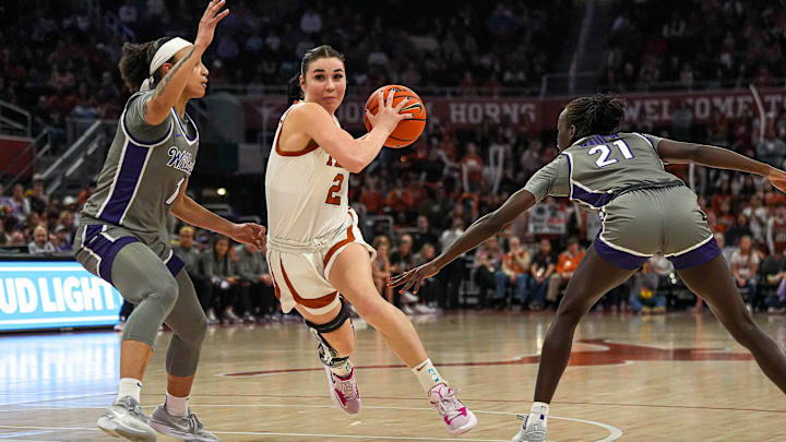 Texas Longhorns guard Shaylee Gonzales (2) pushes past Kansas State guard Zyanna Walker (1) during