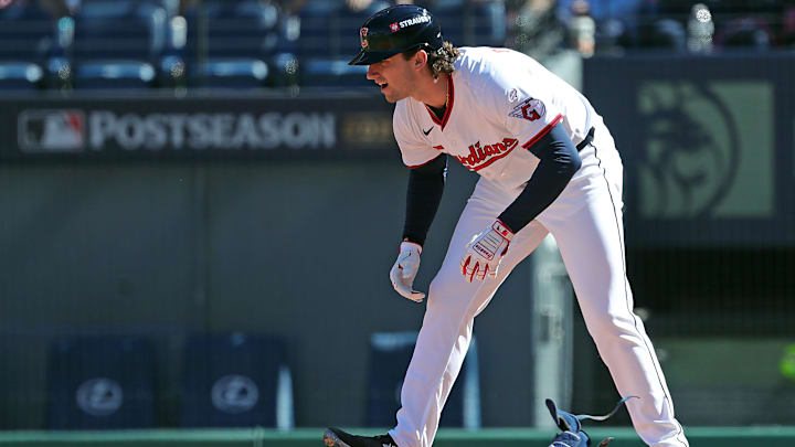 Cleveland Guardians' Chase DeLauter takes off his gear after being walked at his first MLB at-bat during the second inning of Game 2 of the American League Wild Card Series on Oct. 1, 2025, in Cleveland.