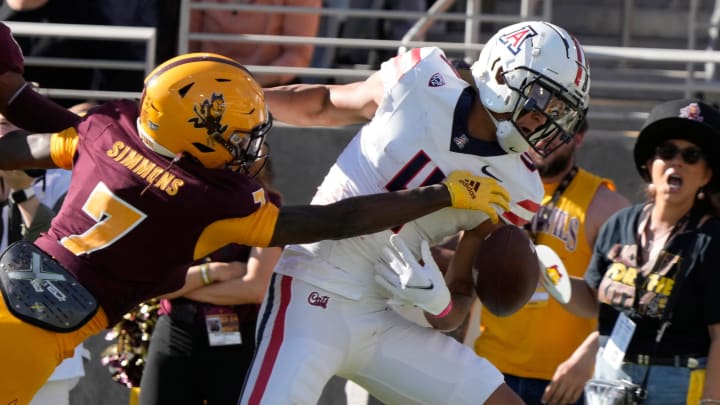 Arizona State defensive back Shamari Simmons (7) defends a pass against Arizona wide receiver Tetairoa McMillan (4) during the first quarter at Mountain America Stadium in Tempe on Nov. 25, 2023.