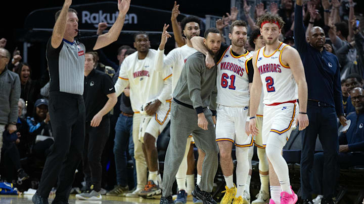 Mar 18, 2025; San Francisco, California, USA; The Golden State Warriors bench celebrates a 3-point basket against the Milwaukee Bucks during the fourth quarter at Chase Center. Mandatory Credit: D. Ross Cameron-Imagn Images
