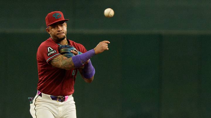 Aug 11, 2026; Phoenix, Arizona, USA; Arizona Diamondbacks infielder Ketel Marte (4) throws across the infield in the ninth inning of a game against the Colorado Rockies at Chase Field. Mandatory Credit: Allan Henry-Imagn Images