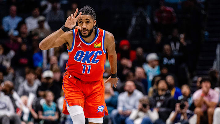 Apr 7, 2024; Charlotte, North Carolina, USA; Oklahoma City Thunder guard Isaiah Joe (11) celebrates a three-point basket against the Charlotte Hornets during the fourth quarter at Spectrum Center. Mandatory Credit: Scott Kinser-Imagn Images