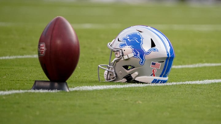 Sep 7, 2023; Kansas City, Missouri, USA; A general view of a Detroit Lions helmet and football on field against the Kansas City Chiefs prior to a game at GEHA Field at Arrowhead Stadium. Mandatory Credit: Denny Medley-Imagn Images Sep 7, 2023; Kansas City, Missouri, USA; A general view of a Detroit Lions helmet and football on field against the Kansas City Chiefs prior to a game at GEHA Field at Arrowhead Stadium. Mandatory Credit: Denny Medley-Imagn Images