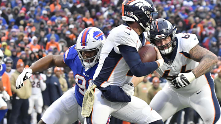 Buffalo Bills defensive tackle Ed Oliver (91) makes a sack on Denver Broncos quarterback Brandon Allen (2) in the fourth quarter at New Era Field.