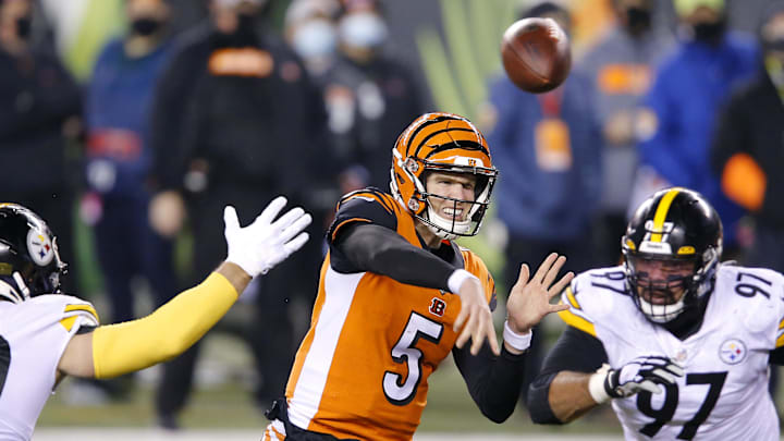Dec 21, 2020; Cincinnati, Ohio, USA;  Cincinnati Bengals quarterback Ryan Finley (5) throws as Pittsburgh Steelers outside linebacker T.J. Watt (90) and defensive end Cameron Heyward (97) defend during the second quarter at Paul Brown Stadium. Mandatory Credit: Joseph Maiorana-Imagn Images