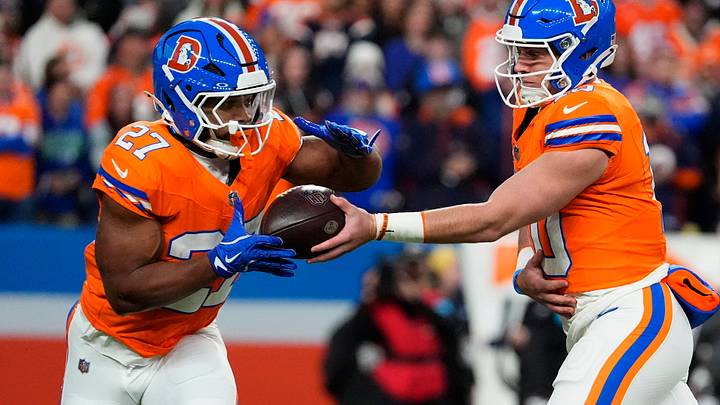 Oct 15, 2026; Denver, Colorado, USA;  Denver Broncos running back J.K. Dobbins (27) receives a handoff from quarterback Bo Nix (10) in the first quarter against the Seattle Seahawks at Empower Field at Mile High.  Mandatory Credit: Ron Chenoy-Imagn Images