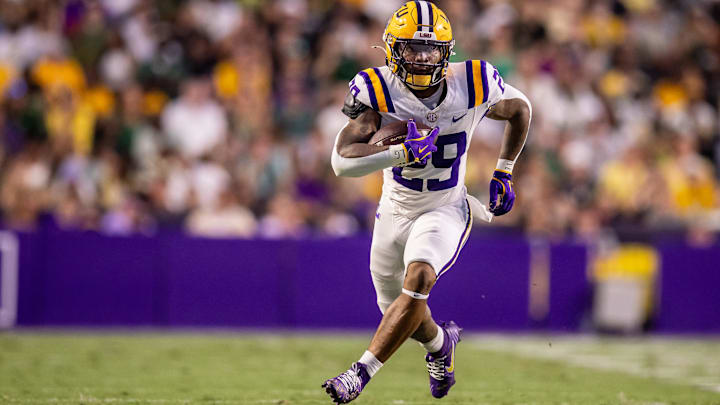 Sep 20, 2025; Baton Rouge, Louisiana, USA;  LSU Tigers running back Caden Durham (29) runs against the Southeastern Louisiana Lions during the first half at Tiger Stadium. Mandatory Credit: Stephen Lew-Imagn Images