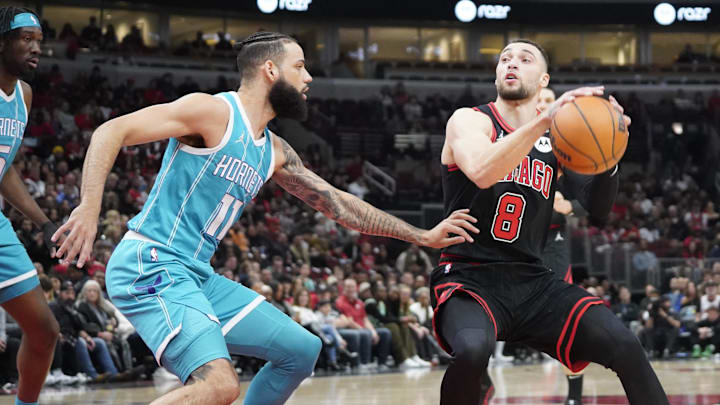 Jan 17, 2025; Chicago, Illinois, USA; Charlotte Hornets forward Cody Martin (11) defends Chicago Bulls guard Zach LaVine (8) during the first quarter at United Center. Mandatory Credit: David Banks-Imagn Images