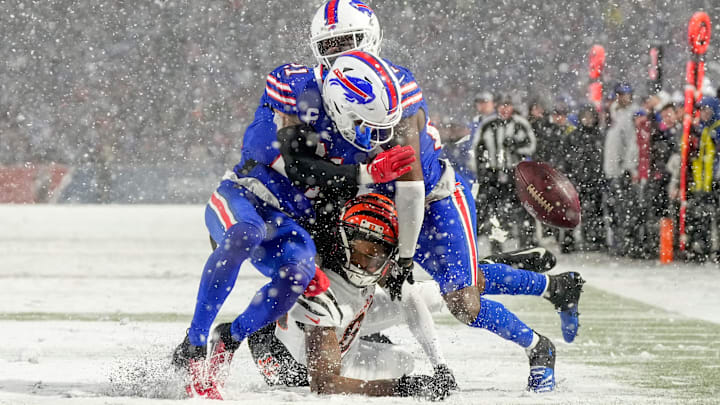Buffalo Bills safety Jordan Poyer (21) and cornerback Tre'Davious White (27) collide over Cincinnati Bengals wide receiver Tee Higgins (85) as they cover a deep pass in the fourth quarter of the NFL divisional playoff football game between the Cincinnati Bengals and the Buffalo Bills. Buffalo Bills safety Jordan Poyer (21) and cornerback Tre'Davious White (27) collide over Cincinnati Bengals wide receiver Tee Higgins (85) as they cover a deep pass in the fourth quarter of the NFL divisional playoff football game between the Cincinnati Bengals and the Buffalo Bills.