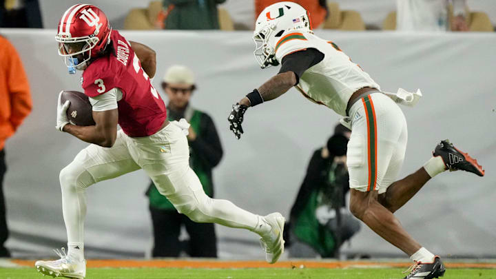 Miami (FL) Hurricanes safety Zechariah Poyser (7) chases after Indiana Hoosiers wide receiver Omar Cooper Jr. (3) on Monday, Jan. 19, 2026, during the College Football Playoff National Championship college football game at Hard Rock Stadium in Miami Gardens.
