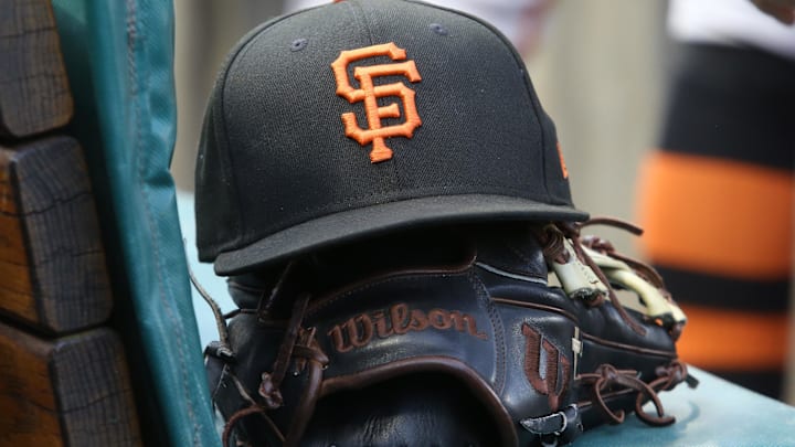 San Francisco Giants hat and glove on the bench against the Pittsburgh Pirates during the first inning at PNC Park. 