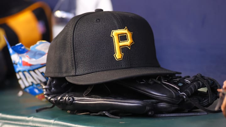 Sep 8, 2023; Atlanta, Georgia, USA; A detailed view of a Pittsburgh Pirates hat and glove before a game against the Pittsburgh Pirates in the first inning at Truist Park. Mandatory Credit: Brett Davis-Imagn Images