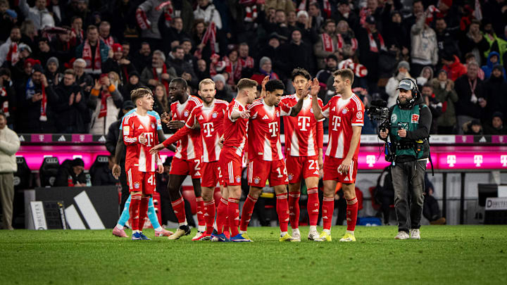 Bayern Munich players celebrating a goal against Hoffenheim.