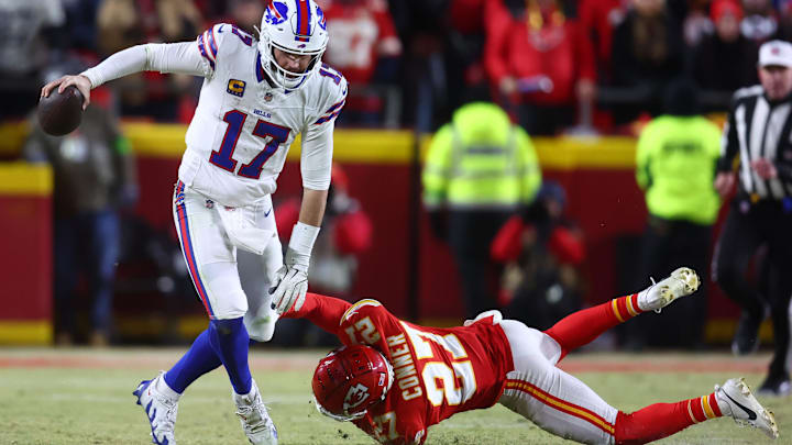 Jan 26, 2025; Kansas City, MO, USA; Buffalo Bills quarterback Josh Allen (17) rushes the ball past Kansas City Chiefs safety Chamarri Conner (27) during the second half in the AFC Championship game at GEHA Field at Arrowhead Stadium. Mandatory Credit: Mark J. Rebilas-Imagn Images