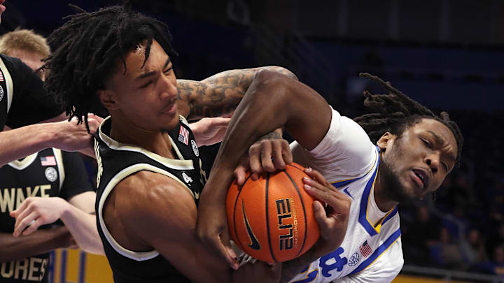 Jan 27, 2026; Pittsburgh, Pennsylvania, USA; Wake Forest Demon Deacons forward Juke Harris (left) and Pittsburgh Panthers guard MacAri Moore (right) fight for a rebound during the first half at the Petersen Events Center. Mandatory Credit: Charles LeClaire-Imagn Images Jan 27, 2026; Pittsburgh, Pennsylvania, USA; Wake Forest Demon Deacons forward Juke Harris (left) and Pittsburgh Panthers guard MacAri Moore (right) fight for a rebound during the first half at the Petersen Events Center. Mandatory Credit: Charles LeClaire-Imagn Images