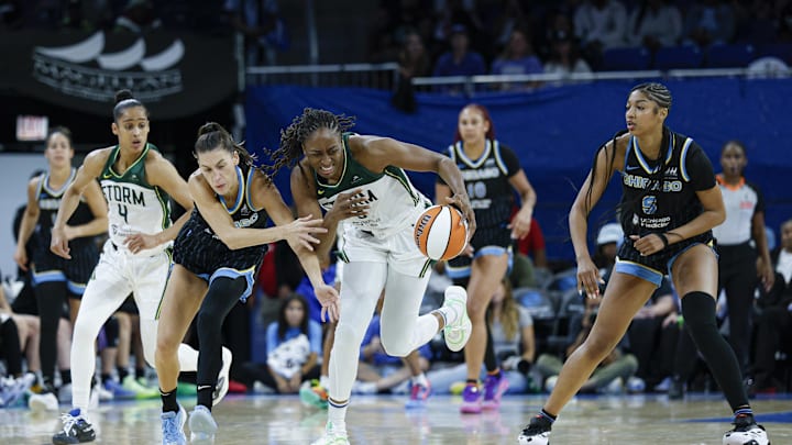 Aug 19, 2025; Chicago, Illinois, USA; Chicago Sky guard Sevgi Uzun (0) tries to defend against Seattle Storm forward Nneka Ogwumike (3) during the second half at Wintrust Arena. Mandatory Credit: Kamil Krzaczynski-Imagn Images